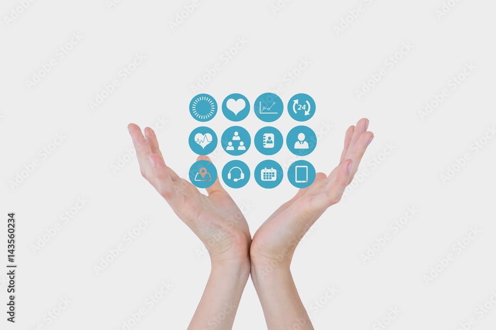 Digital composite image of hands with medical icons