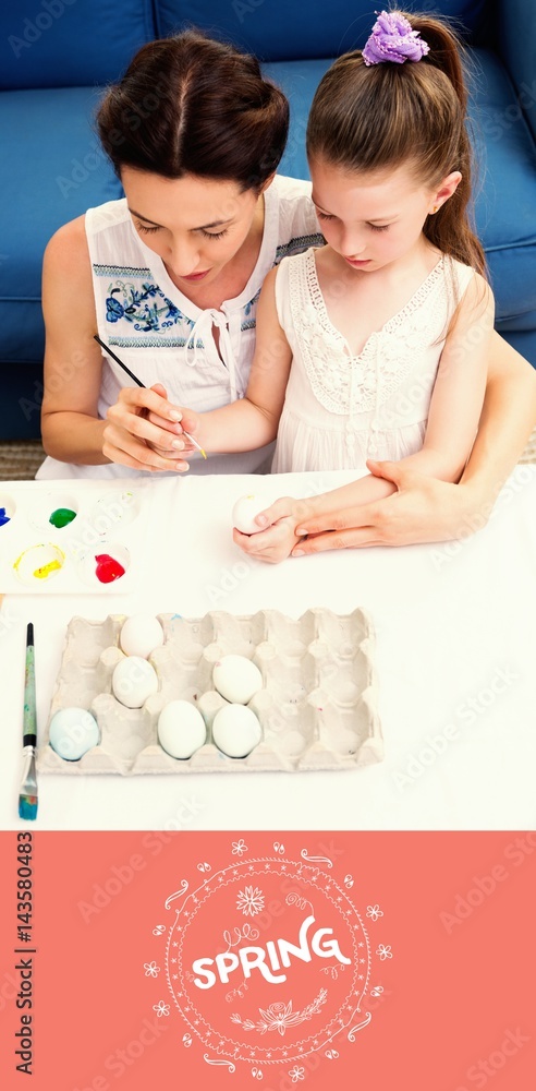 Composite image of mother and daughter painting easter eggs