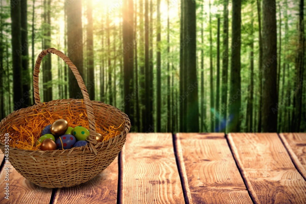 Composite image of easter eggs in paper nest basket