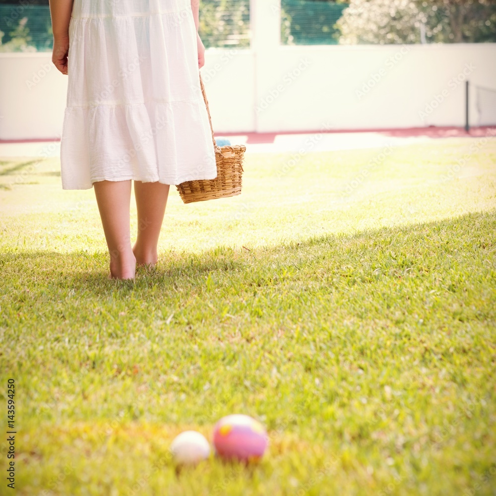 Little girl collecting easter eggs