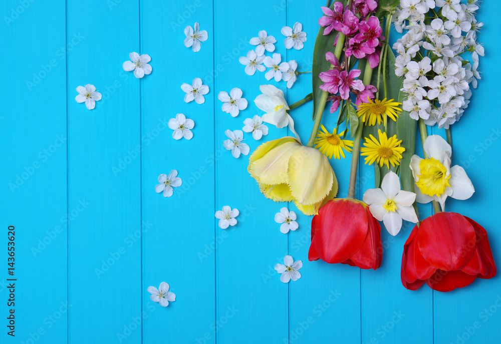 Tulips on a wooden background