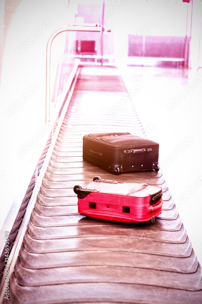 High angle view of suitcase on baggage claim