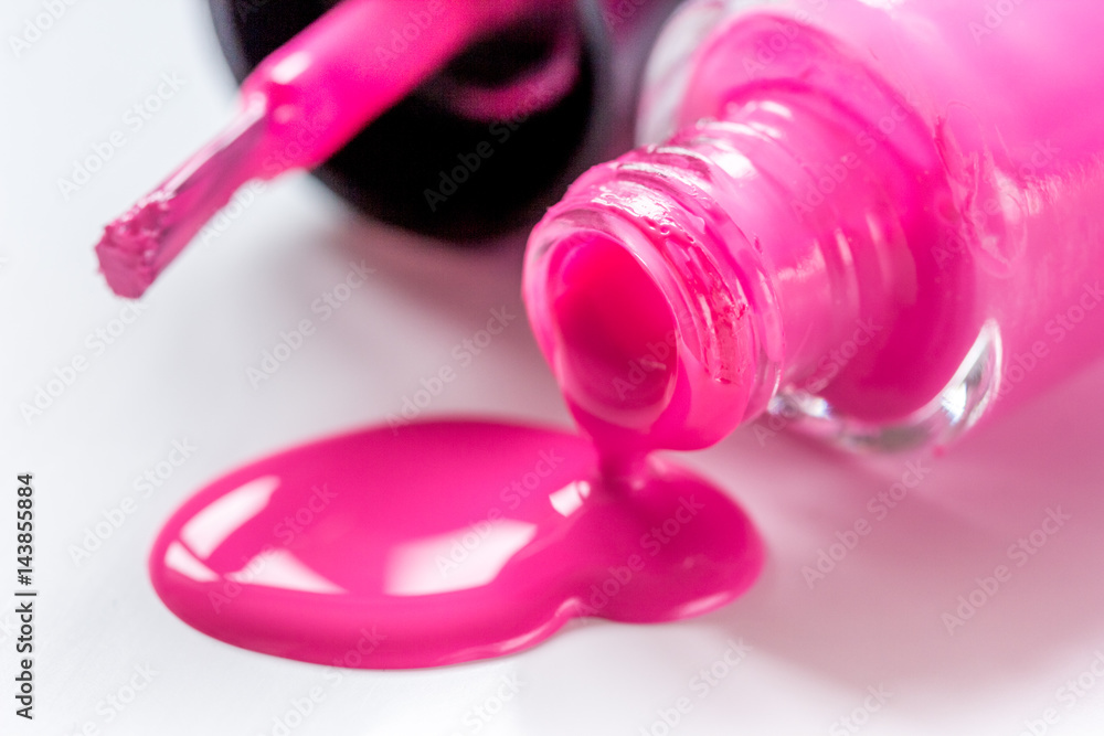 Bottles with spilled nail polish over white background mockup