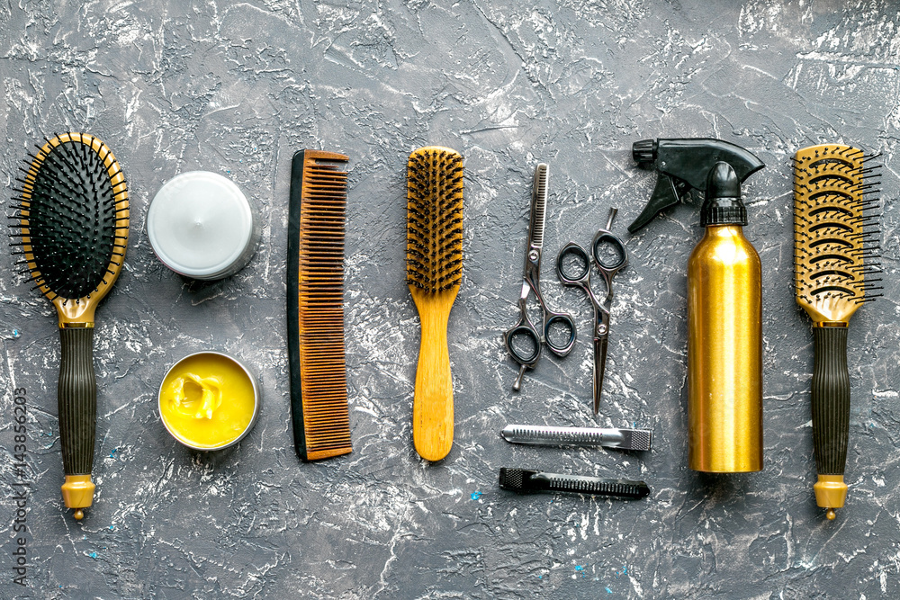 hairdressing concept with barber tools on gray background top view mock up