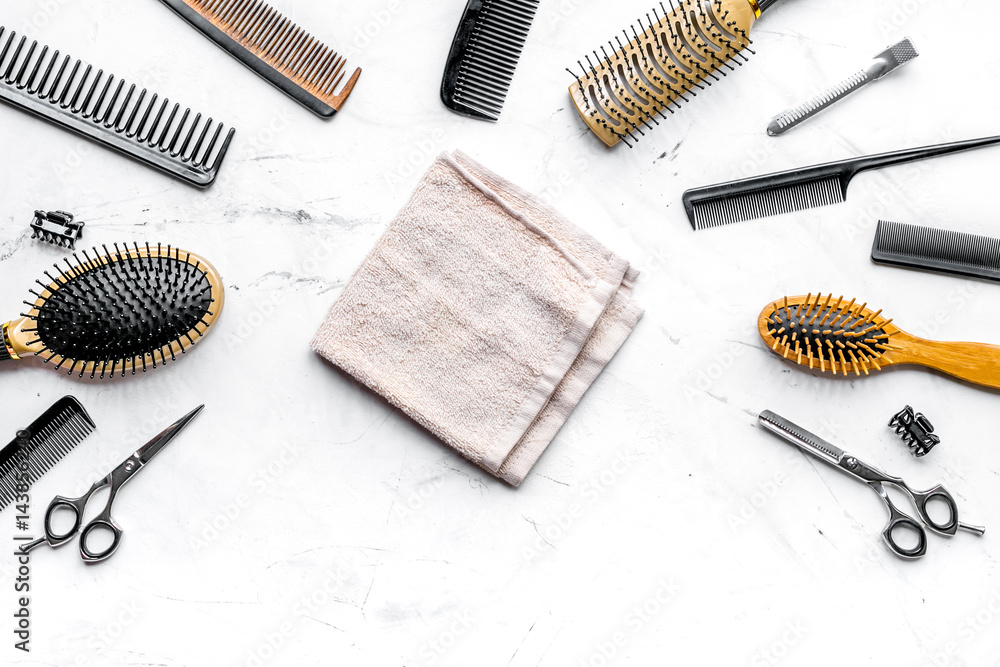 hairdresser working desk with tools on white background top view