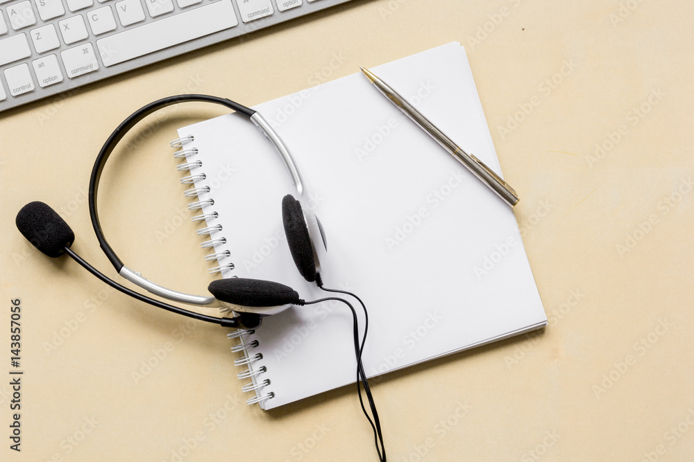 call center manager work desk with headset top view