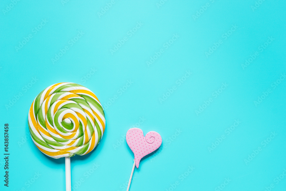 lollipop design with sugar candys on blue background top view mockup