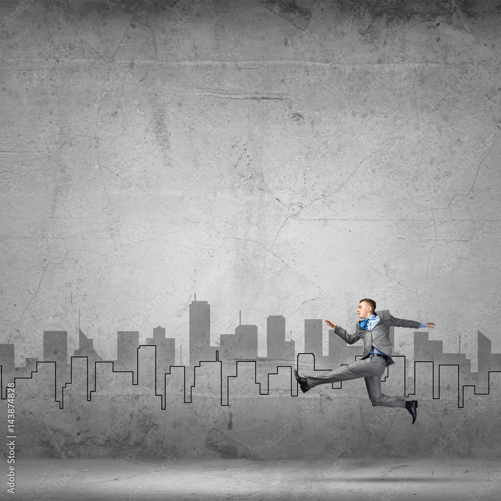 Businessman jumping high