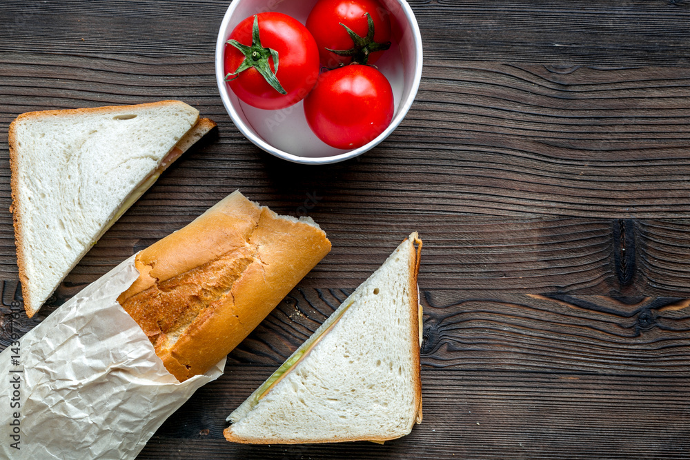 tomato with bread and sandwich on table background top view mock up