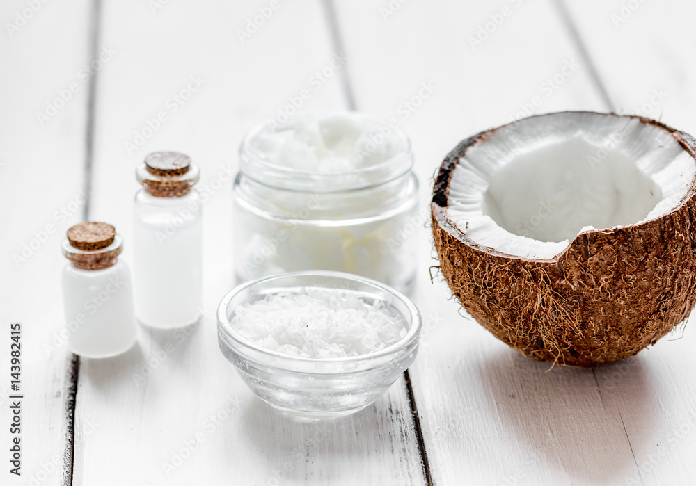 organic cosmetics with coconut on white background