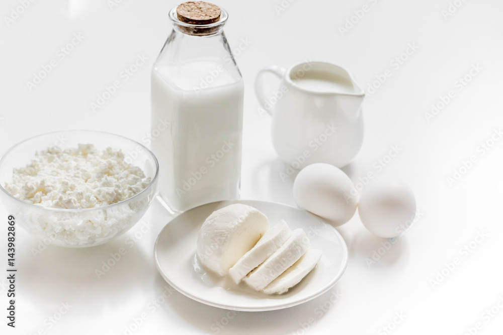 dairy products for proteic meal on white table background