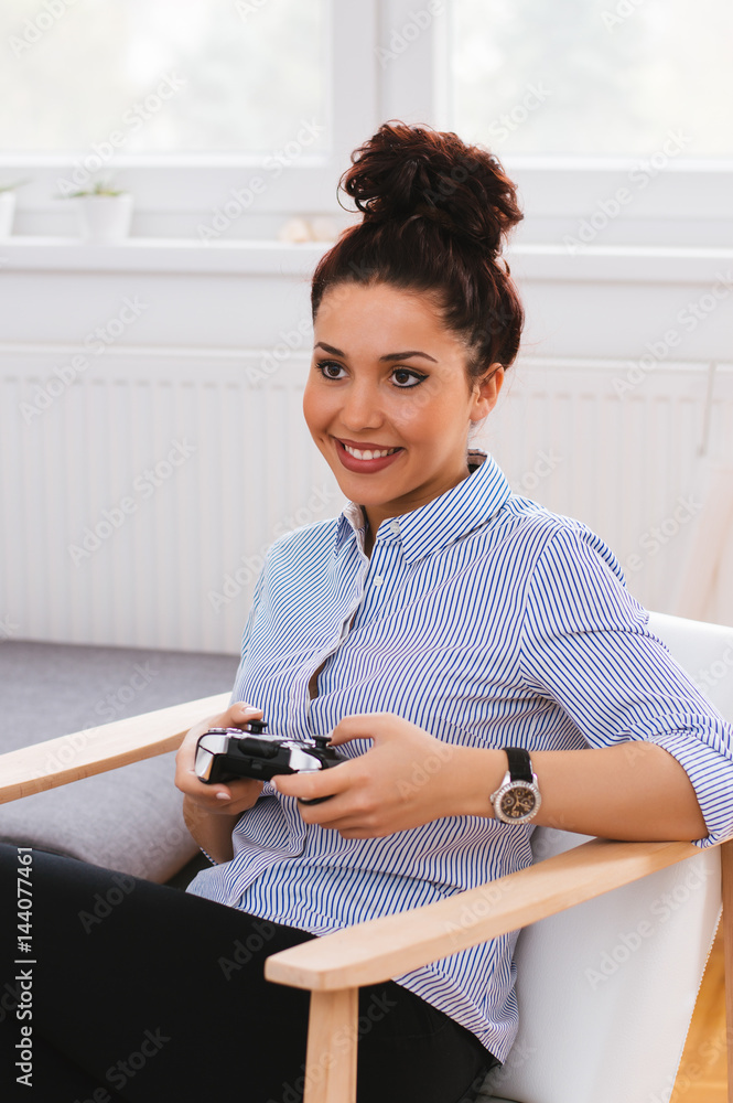 Young girl playing games at home