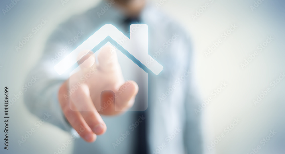 Businessman touching 3D rendering icon house with his finger