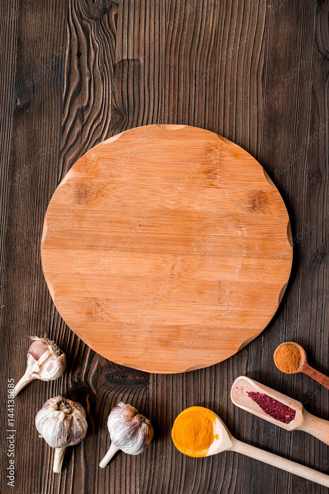 cook work with kitchenware set on dark background top view