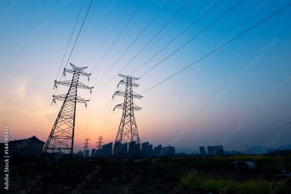 pylons in blue sky at sunrise