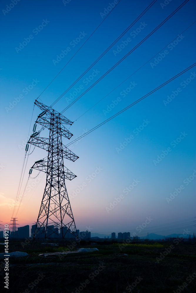 pylons in blue sky at sunrise