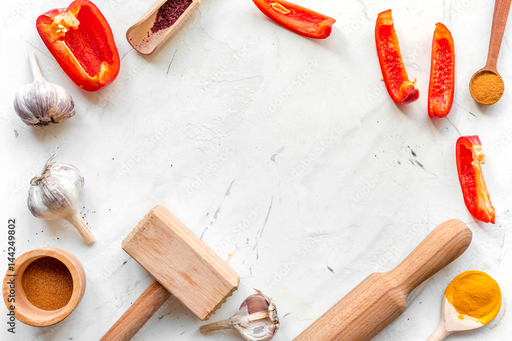 Cook workplace with kitchen tools and garlic white background top view mockup