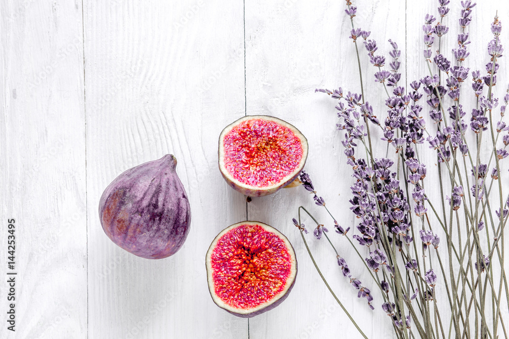 cut fig with lavender design on white background top view mockup