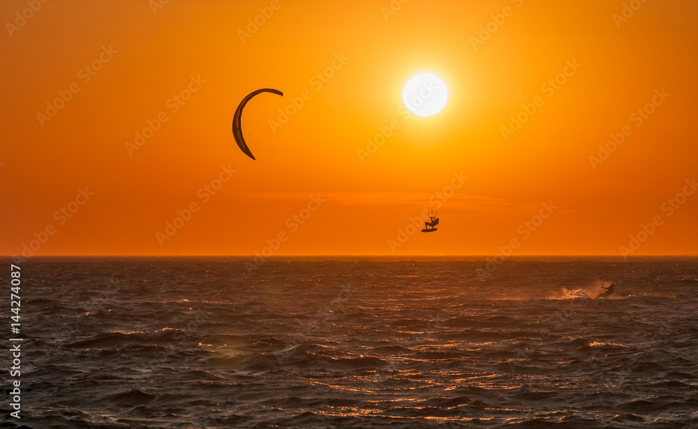 Kite surf and sunset at Mykonos island, Greece.