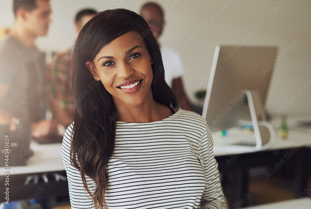 Portrait of smiling young woman in office