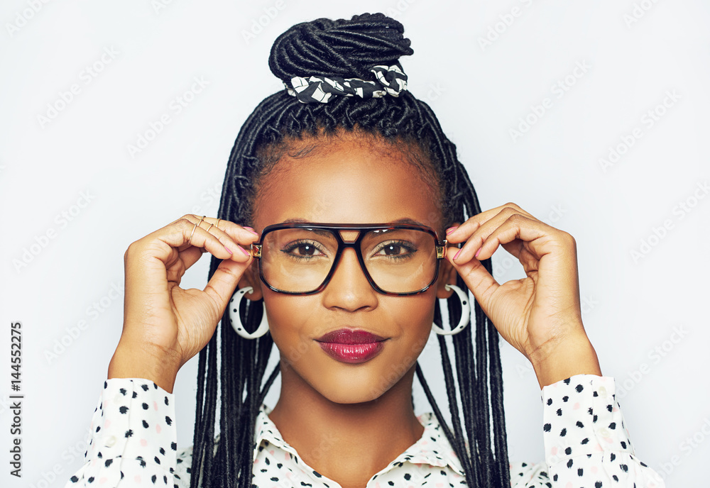 Black woman trying on glasses