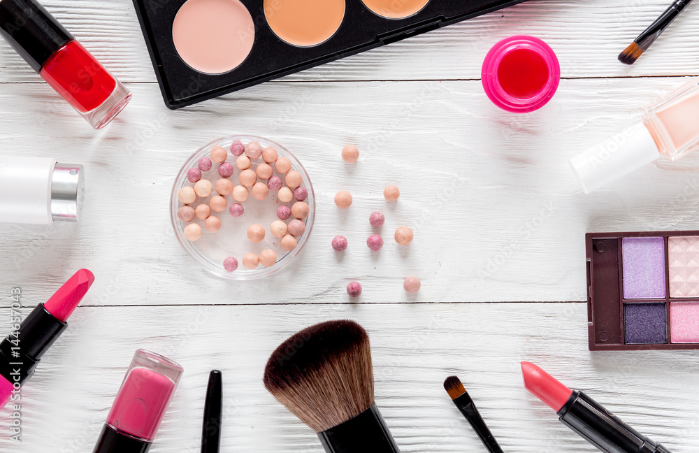 set of cosmetics for women with lavender white background top view