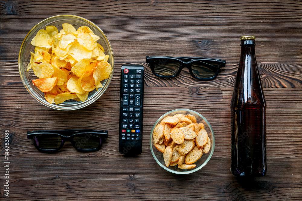 snacks for watching TV on wooden background top view mock-up