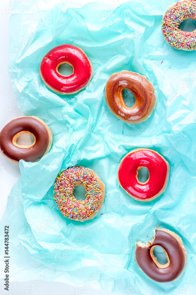 donat pattern on blue paper background top view