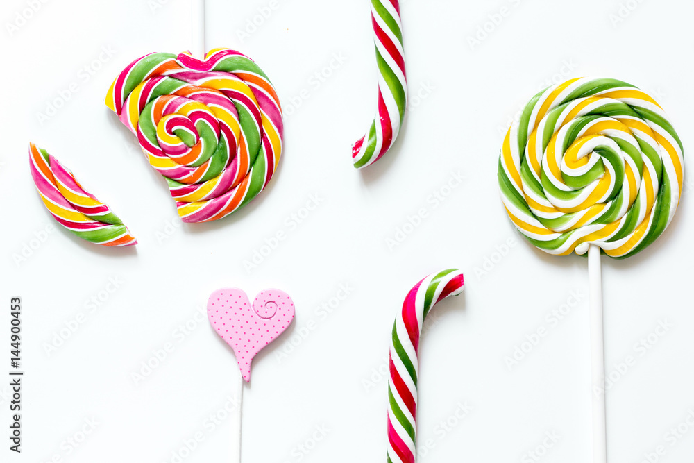 sweets and sugar candies on white background top view