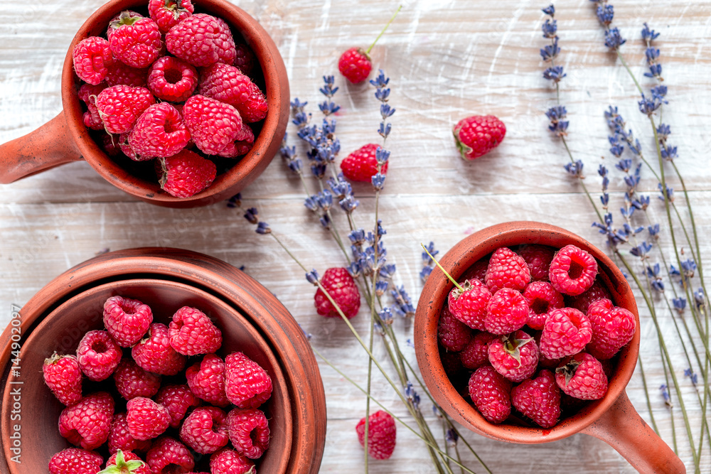 raspberry composition with dry lavender rustic background top view