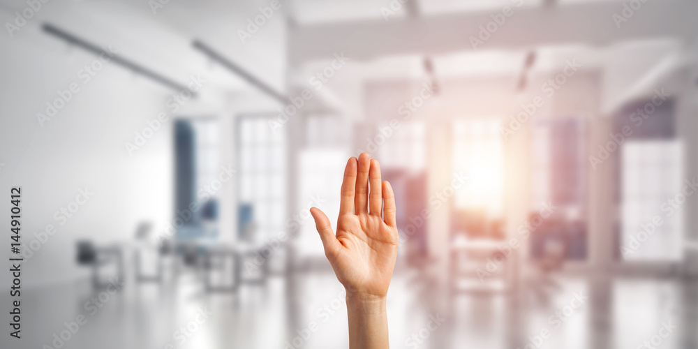 Choosing gesture of person in elegant modern interior in sunshine light