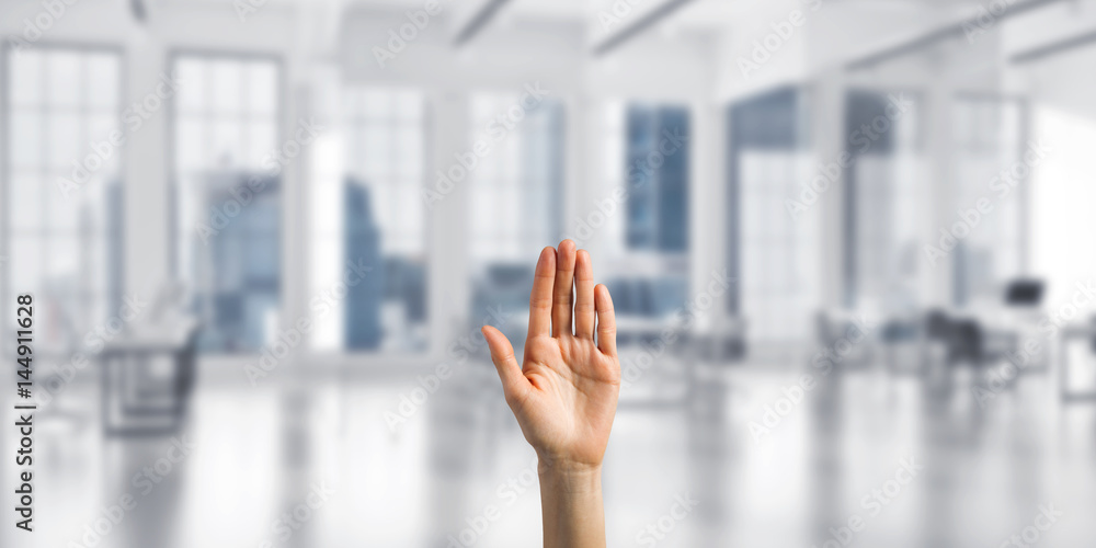 Choosing gesture of person in elegant modern interior in sunshine light