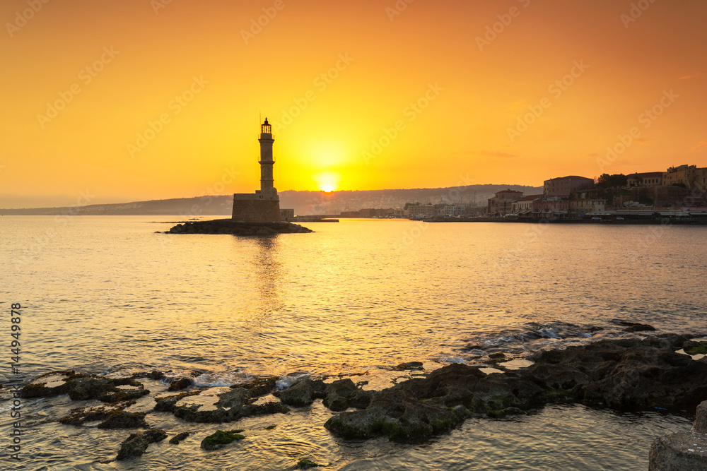 Lighthouse of the old Venetian port in Chania at sunrise, Crete. Greece