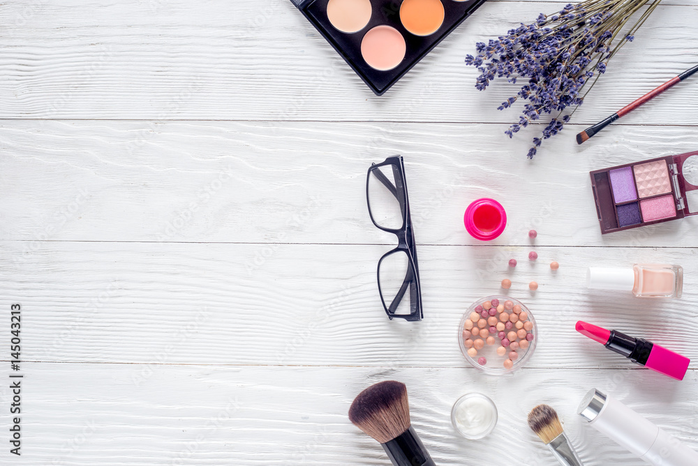 glasses and cosmetics on white woman table background top view