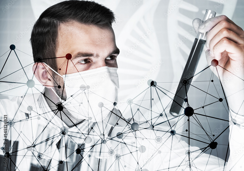 Portrait of concentrated male scientist working with reagents in laboratory