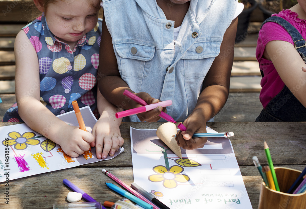 Group of kindergarten kids friends drawing art class outdoors