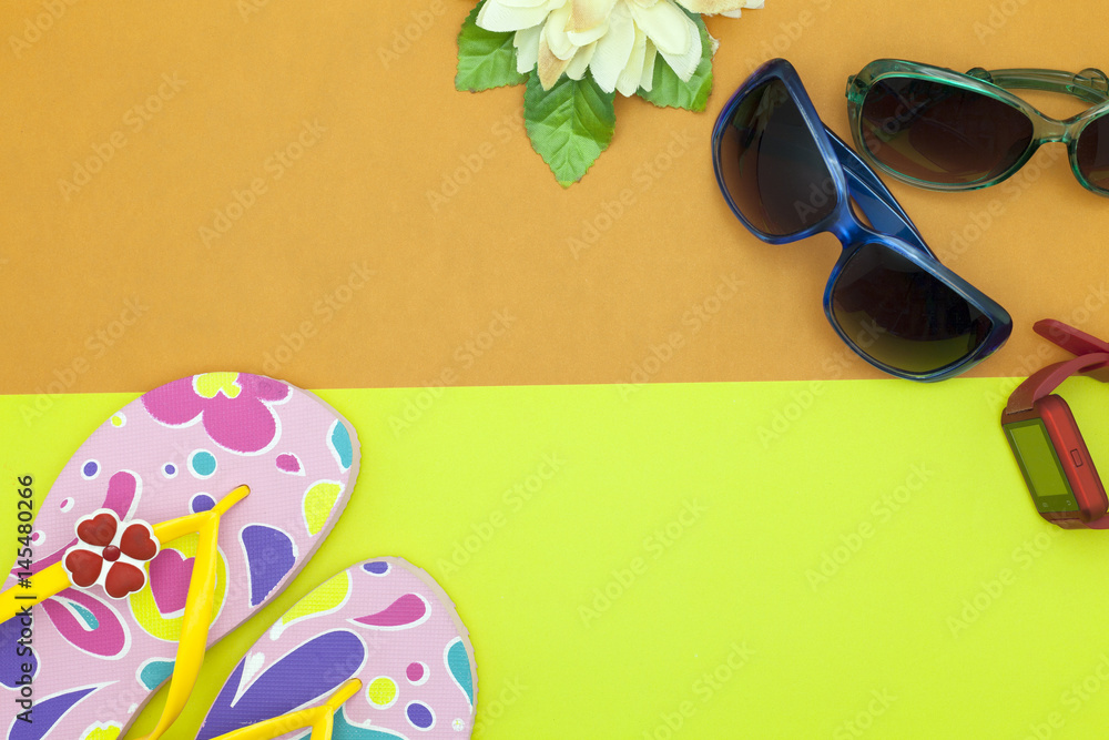 sunglasses with beach shoes and flower on colorful paper background,summer holiday  background conce