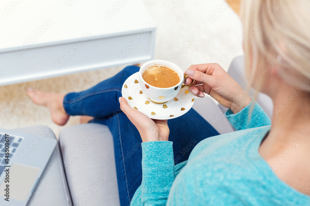 Young woman drinking a cup of coffee