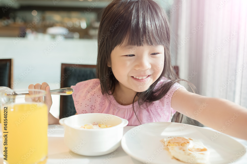 cute girl eat breakfast