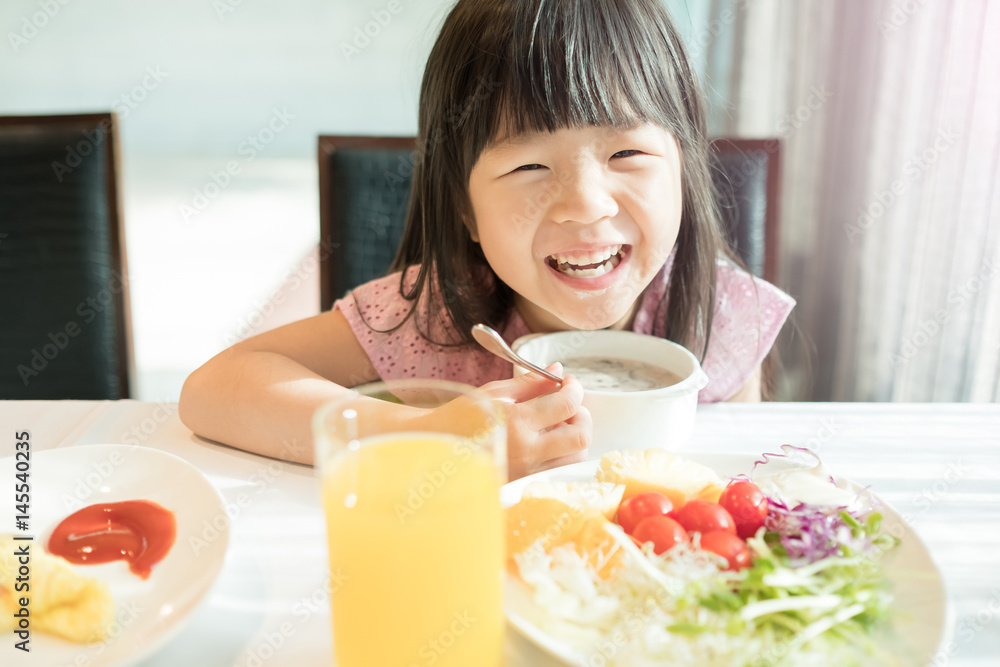 cute girl eat breakfast