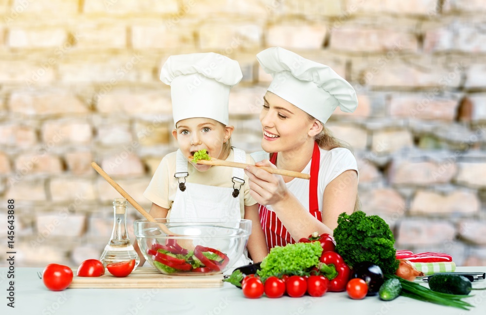 Woman and child cooking.