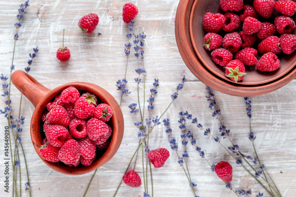 raspberry composition with dry lavender rustic background top view