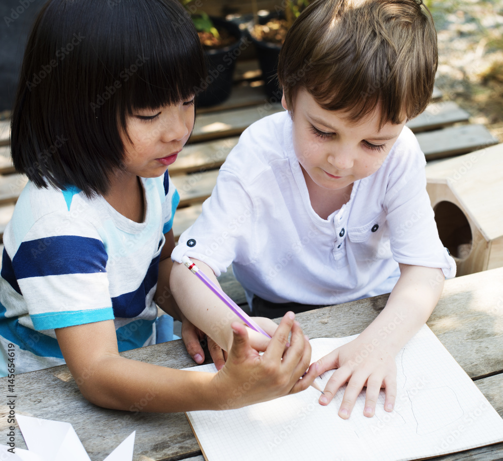 Children are drawing some idea together