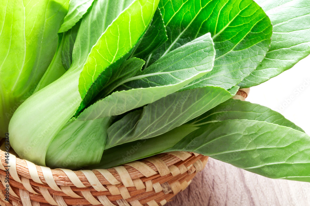 close up the Fresh baby green bok choy in basket