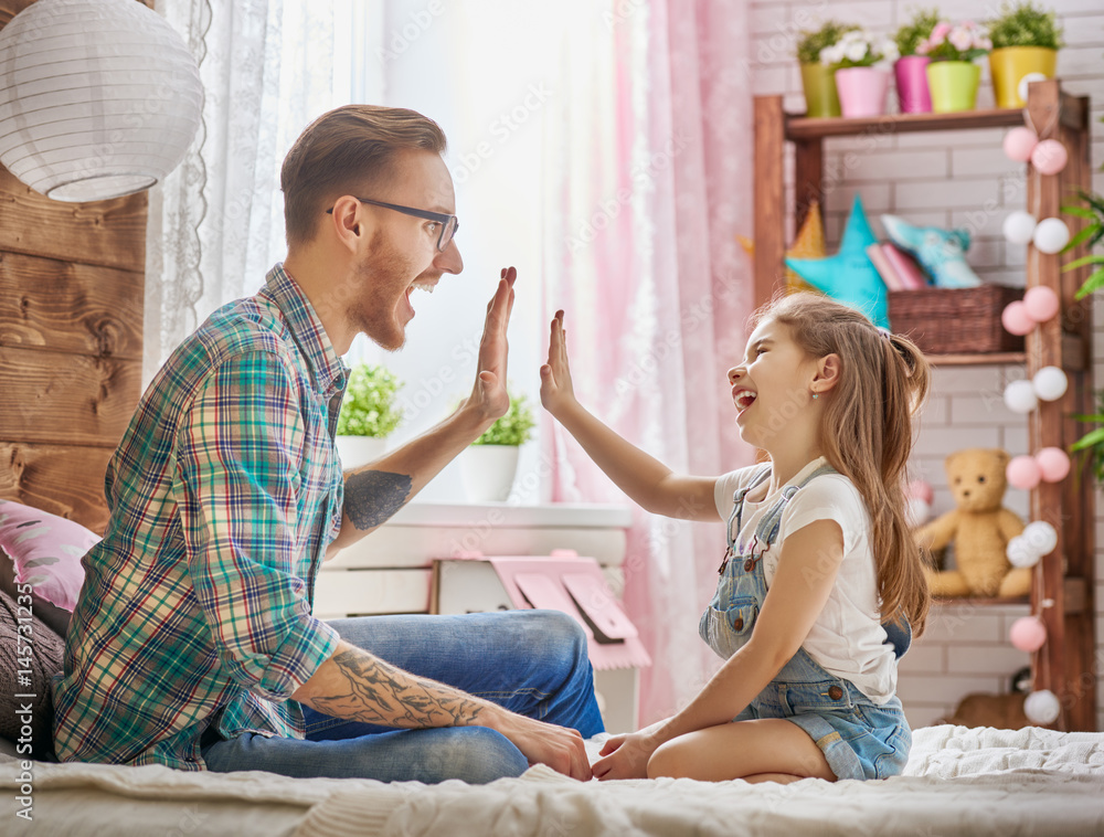 father and daughter play