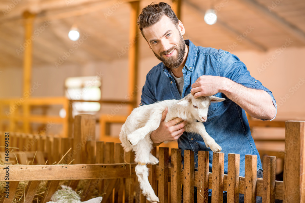 Famer with small goat