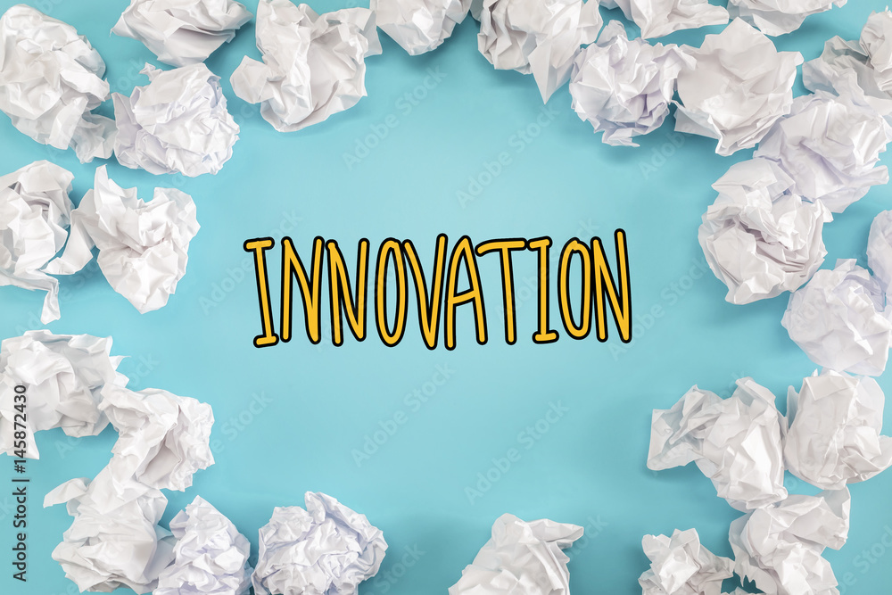 Innovation text with crumpled paper balls