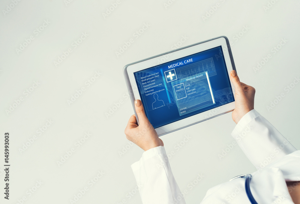 Close of female doctor hands working with tablet pc computer