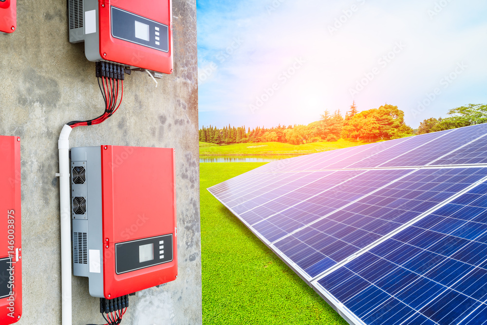 Solar panels and power control panels on green field