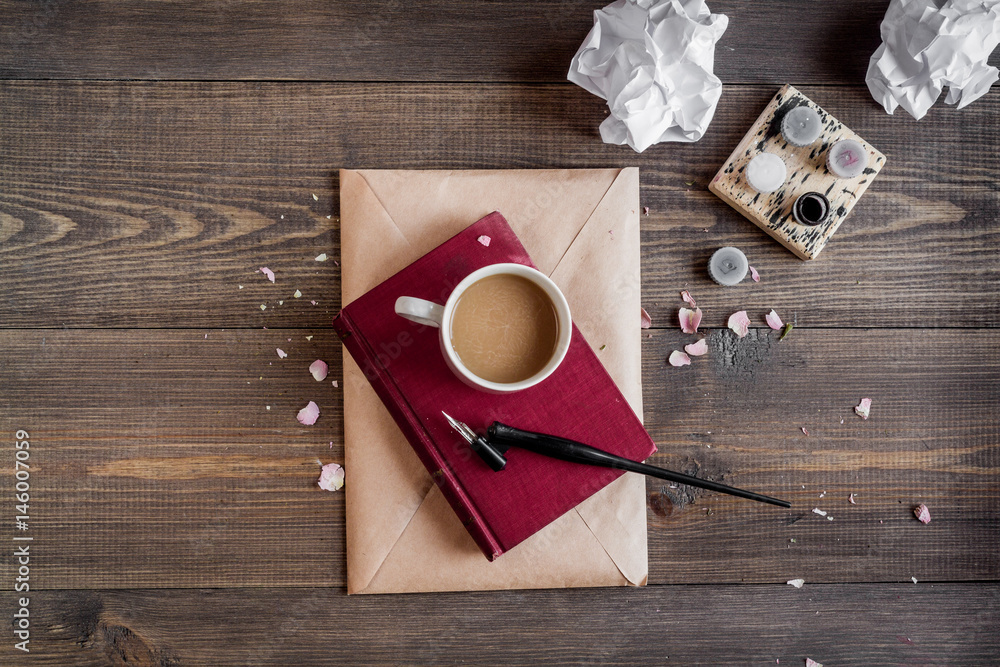 writer workplace with tools on wooden background top view mockup